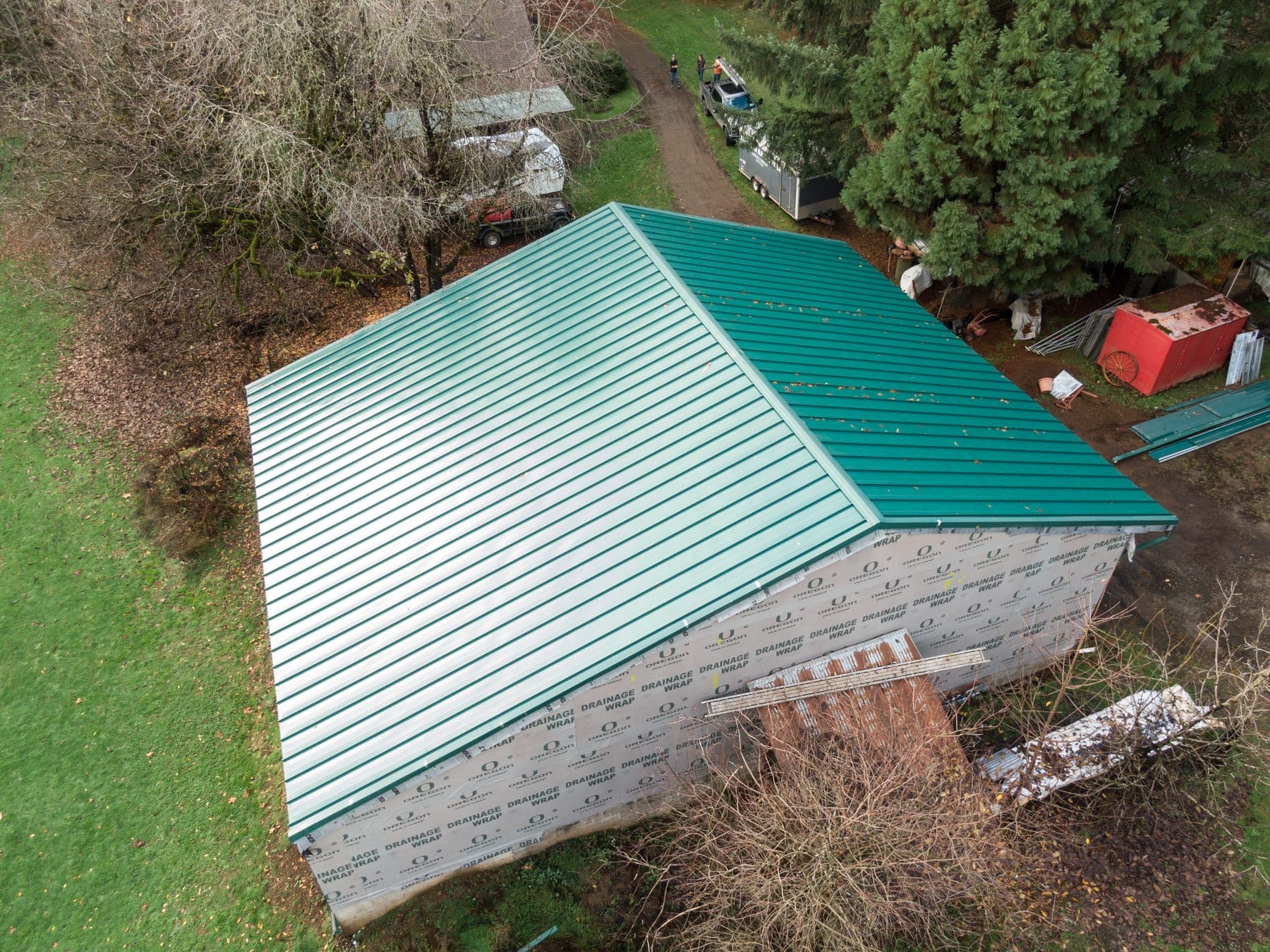 Aerial view of a new standing-seam metal roof installed by SA Roofing on a Portland-area home